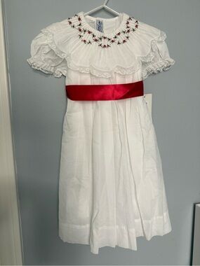 White Smocked Girls' Dress with Red Satin Sash